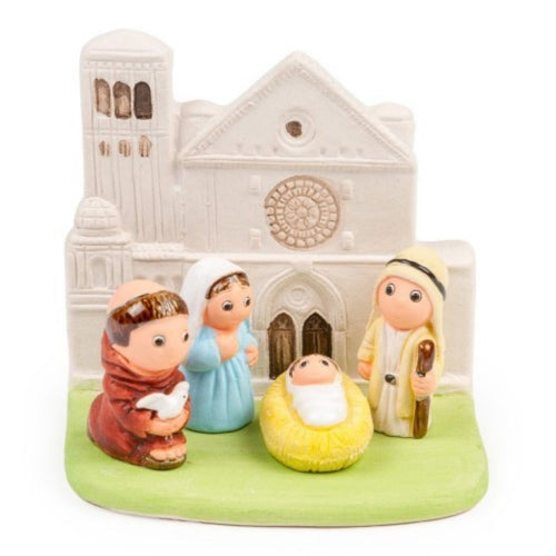 Nacimiento artesanal con San Francisco de Asís sosteniendo una paloma.