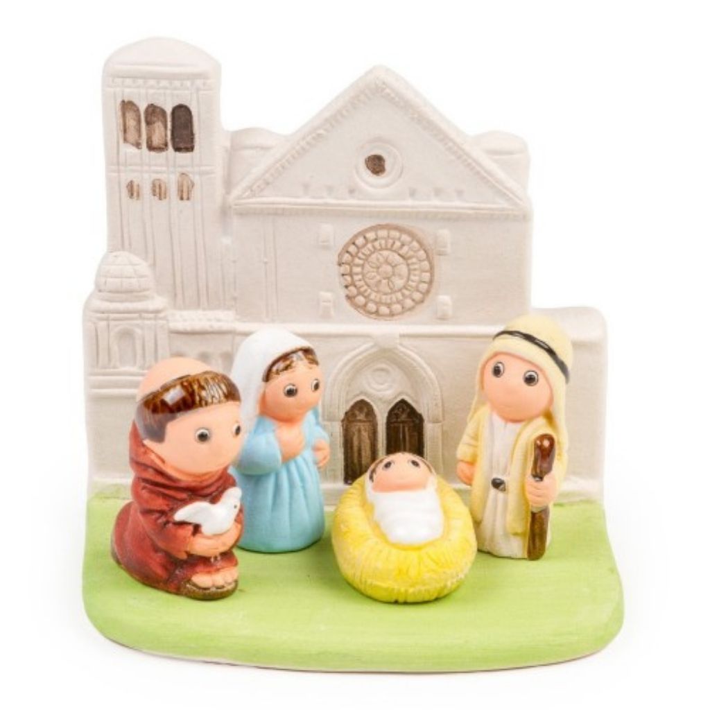 Nacimiento artesanal con San Francisco de Asís sosteniendo una paloma.